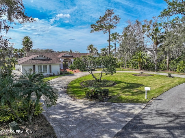 exterior space with a front yard