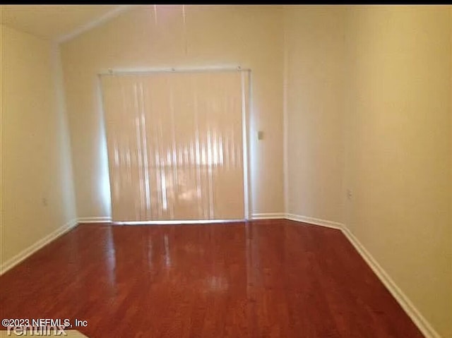 unfurnished room featuring hardwood / wood-style floors