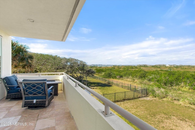 balcony featuring a rural view