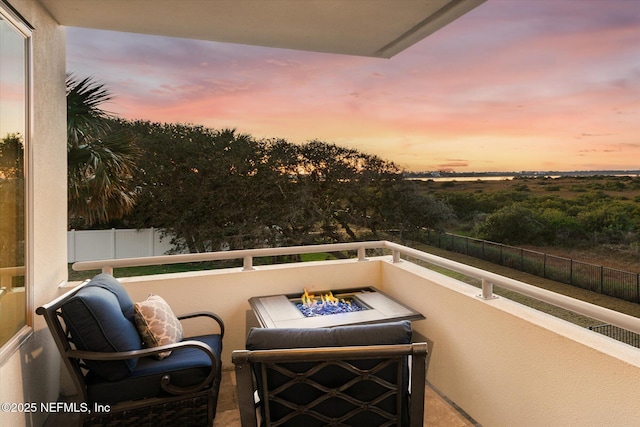 view of balcony at dusk