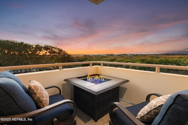 view of balcony at dusk