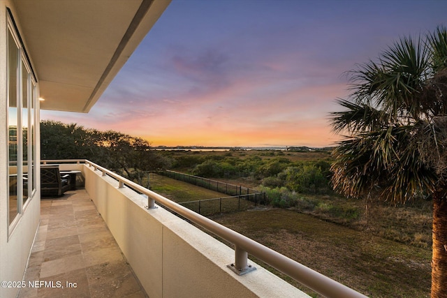 view of balcony at dusk