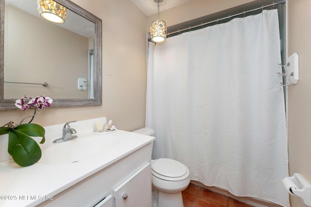 full bath with tile patterned flooring, vanity, and toilet