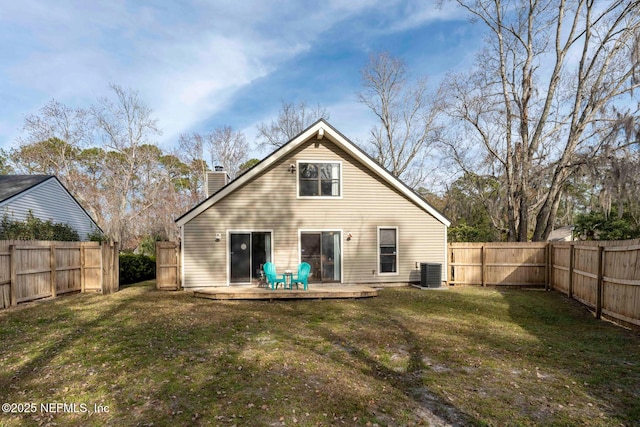 rear view of property featuring a patio, a yard, and central AC unit