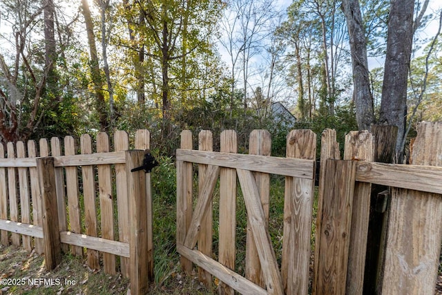 view of gate featuring fence