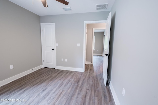 unfurnished bedroom featuring ceiling fan and light hardwood / wood-style floors