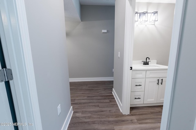 bathroom featuring vanity and hardwood / wood-style flooring