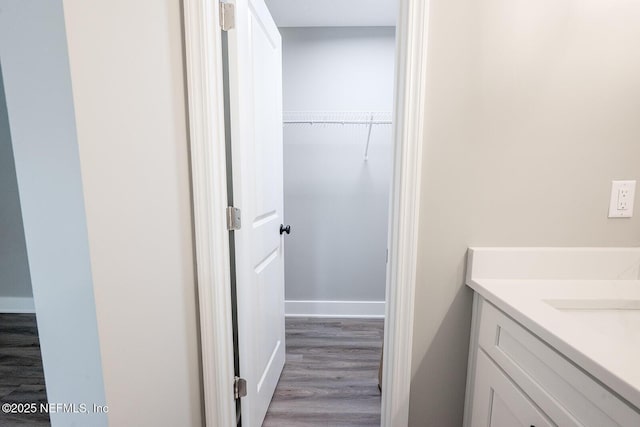 bathroom featuring vanity and hardwood / wood-style floors