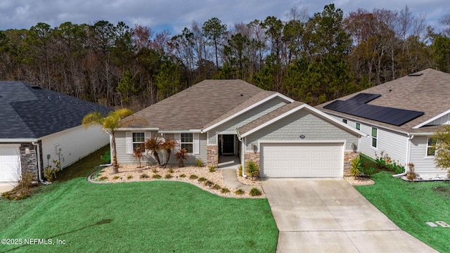 view of front of house featuring a garage and a front yard