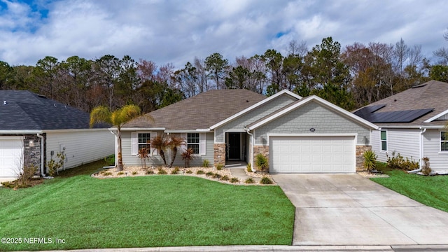 view of front of house with a garage and a front yard