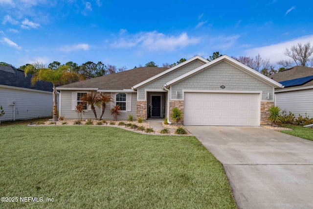 view of front of house with a garage and a front yard