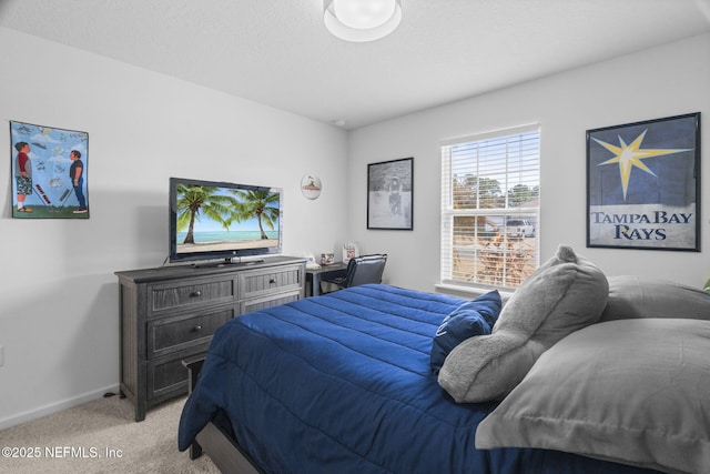 carpeted bedroom featuring a textured ceiling