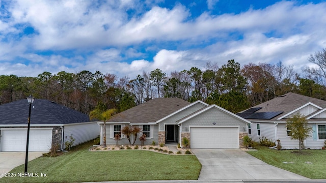 view of front facade featuring a garage and a front lawn