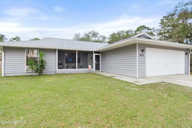 ranch-style home with a garage and a front lawn