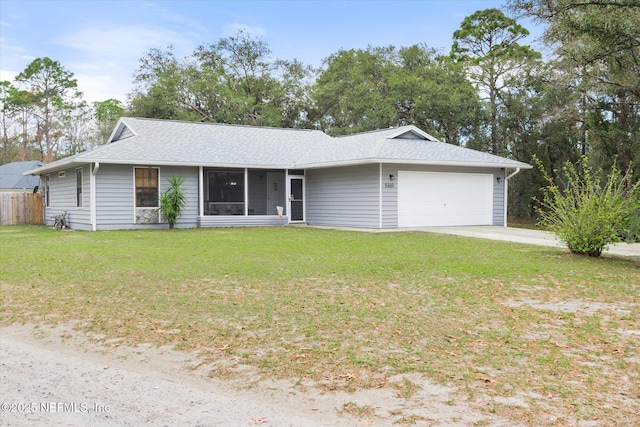 ranch-style home with a garage and a front yard