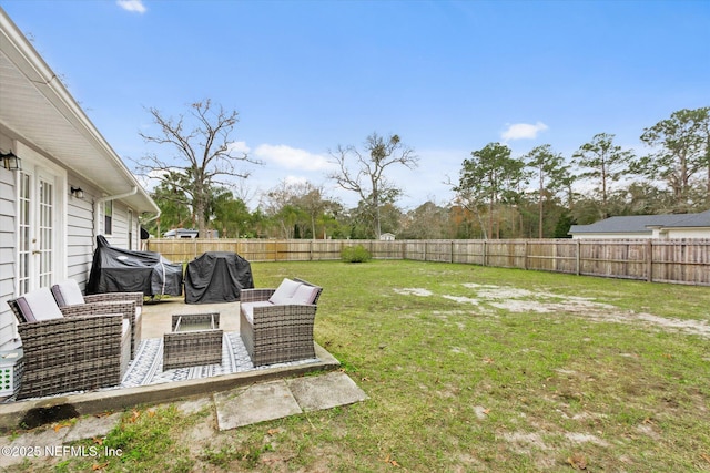 view of yard featuring an outdoor living space and a patio