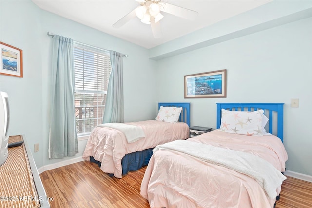 bedroom featuring ceiling fan and light hardwood / wood-style floors