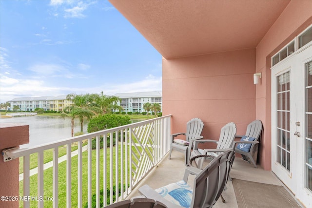 balcony featuring a water view