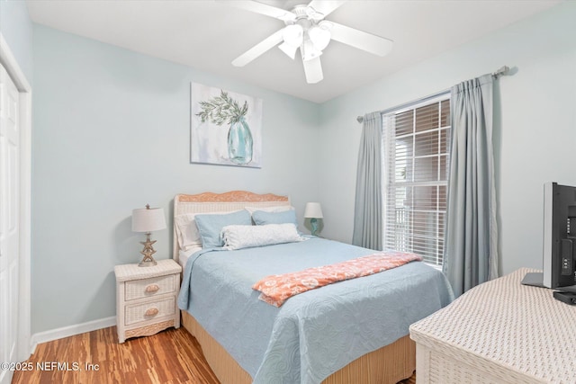 bedroom with ceiling fan and light wood-type flooring