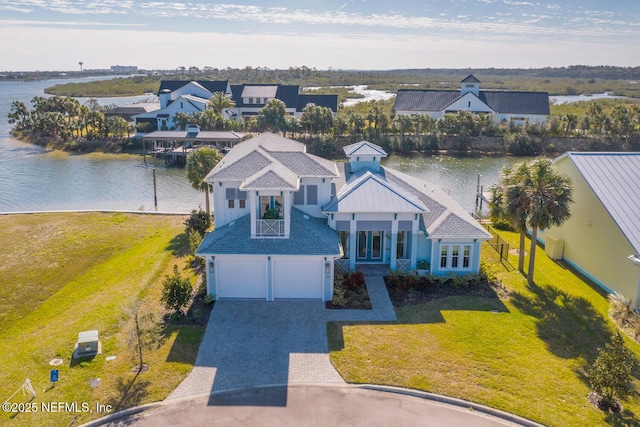 birds eye view of property with a water view