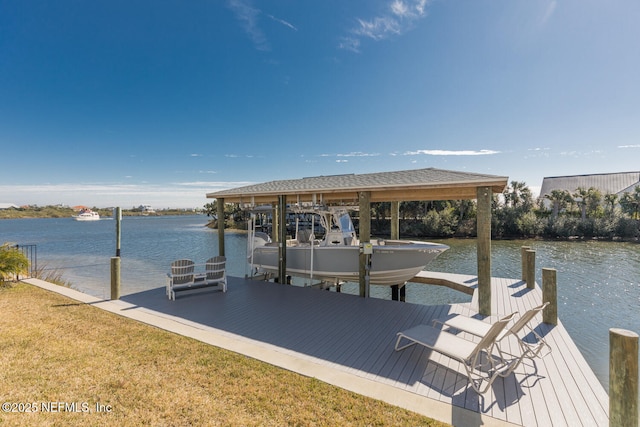 dock area featuring a water view and a lawn