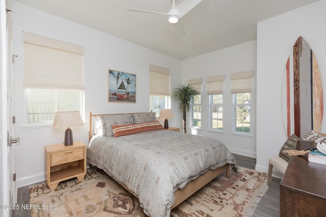 bedroom with hardwood / wood-style flooring and ceiling fan