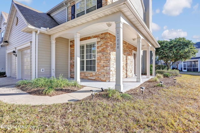 view of home's exterior with a porch and a garage