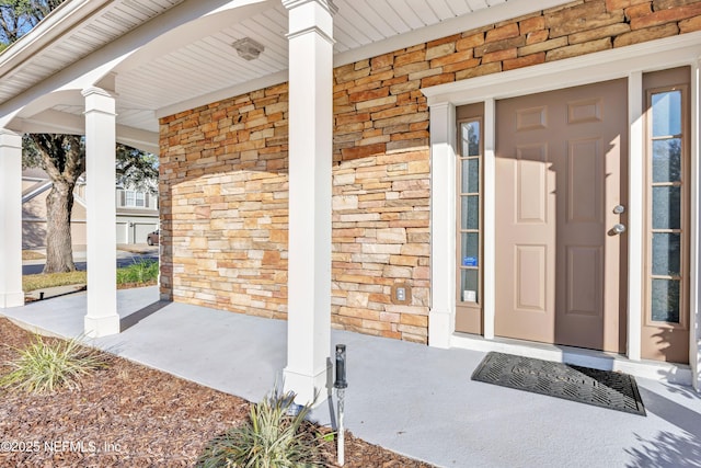 doorway to property featuring a porch