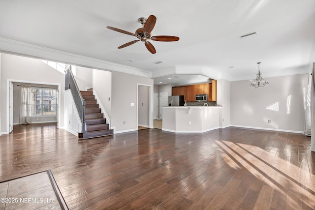 unfurnished living room featuring crown molding, dark hardwood / wood-style floors, and ceiling fan with notable chandelier