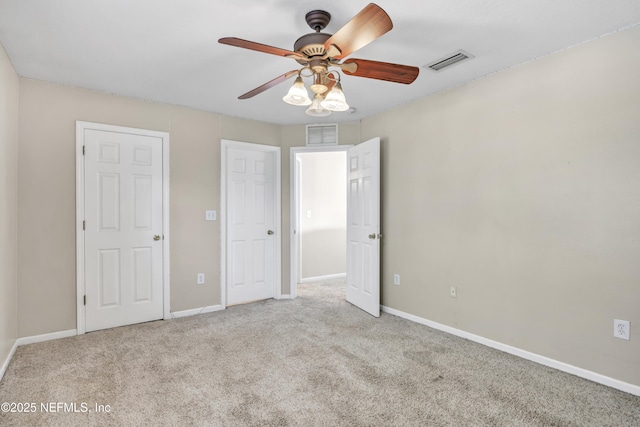 unfurnished bedroom with light carpet and ceiling fan