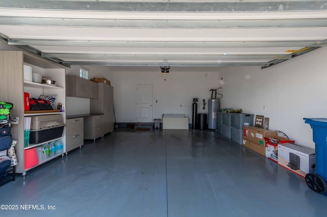 garage with water heater and a garage door opener