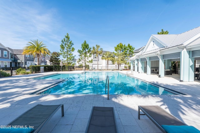 view of swimming pool with a patio area