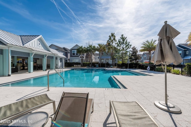 view of swimming pool featuring a patio area