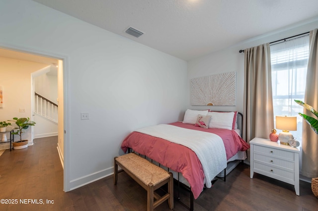 bedroom featuring dark hardwood / wood-style floors