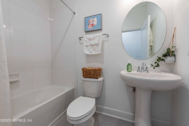 bathroom with bathing tub / shower combination and toilet