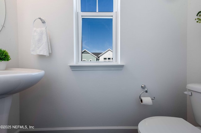 bathroom featuring sink and toilet