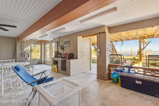 view of patio featuring area for grilling and ceiling fan