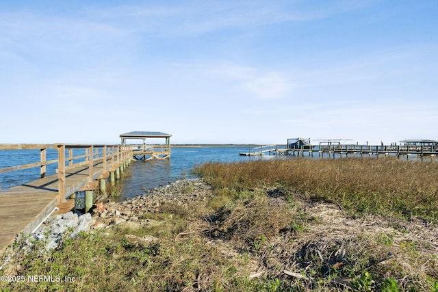 dock area featuring a water view