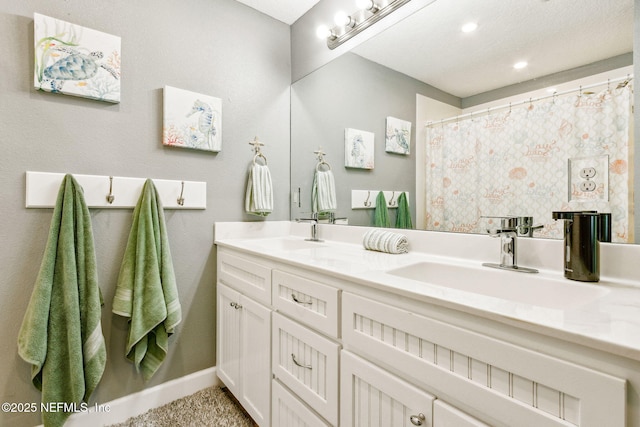 bathroom featuring a shower with curtain and vanity