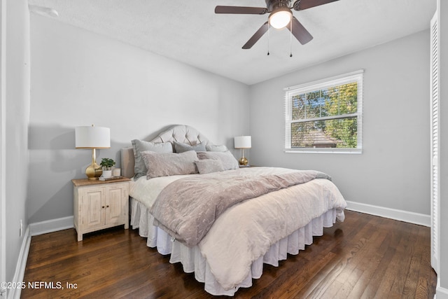 bedroom featuring dark wood-type flooring and ceiling fan