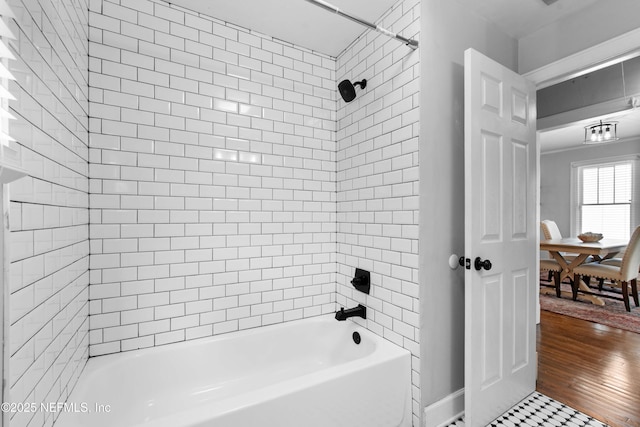 bathroom featuring tiled shower / bath combo