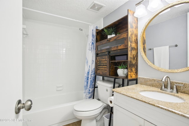 full bathroom with shower / tub combo with curtain, vanity, toilet, and a textured ceiling