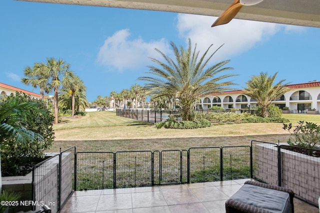 exterior space featuring ceiling fan