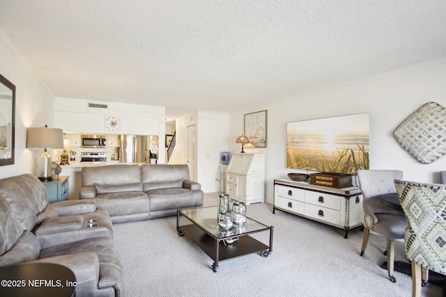 carpeted living room featuring crown molding and a textured ceiling