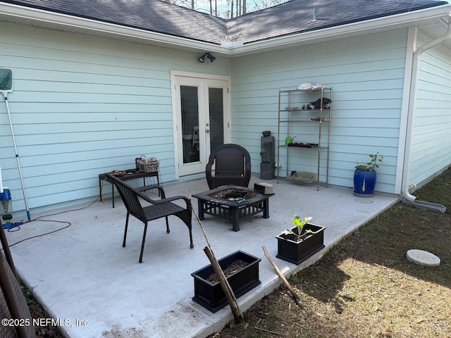 view of patio featuring a fire pit and french doors