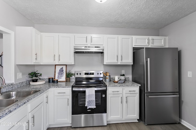 kitchen featuring white cabinetry, appliances with stainless steel finishes, and sink