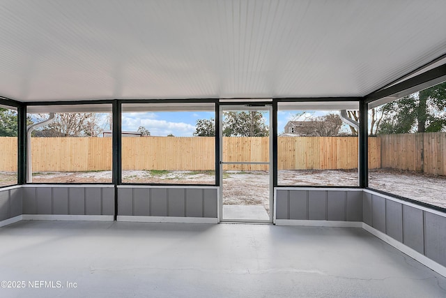 unfurnished sunroom with plenty of natural light