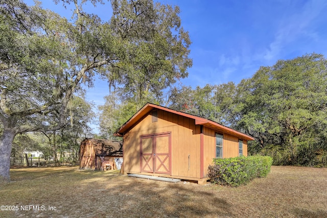 view of outdoor structure featuring a yard