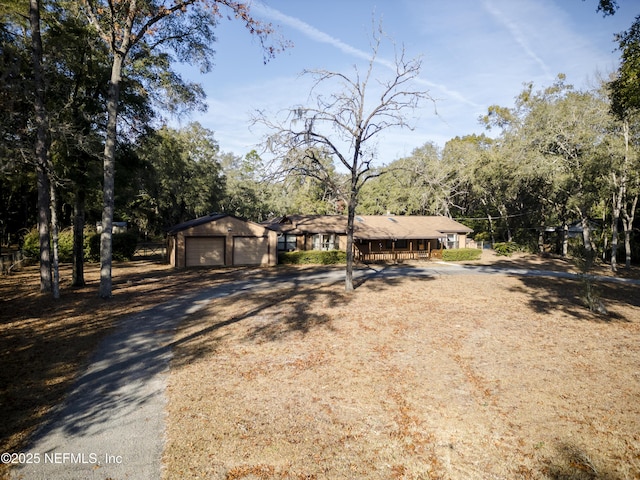 ranch-style house with an outbuilding and a garage