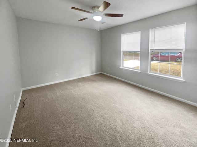 unfurnished room featuring carpet flooring and ceiling fan